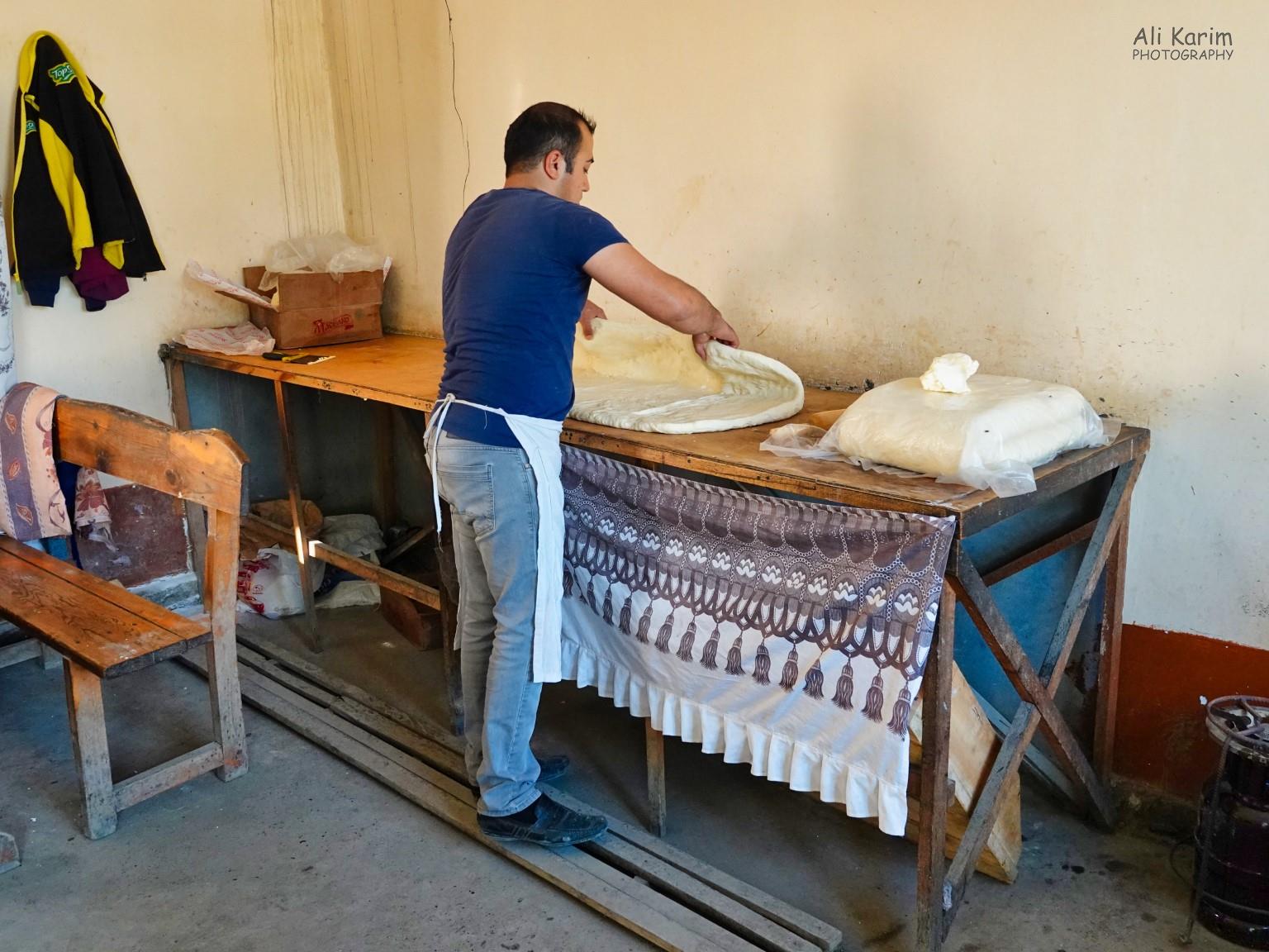 Rolling out the dough for more samsa’s for the evening at the roadside bakery Samarkand, Uzbekistan Rolling out the dough for more samsa’s for the evening at the roadside bakery