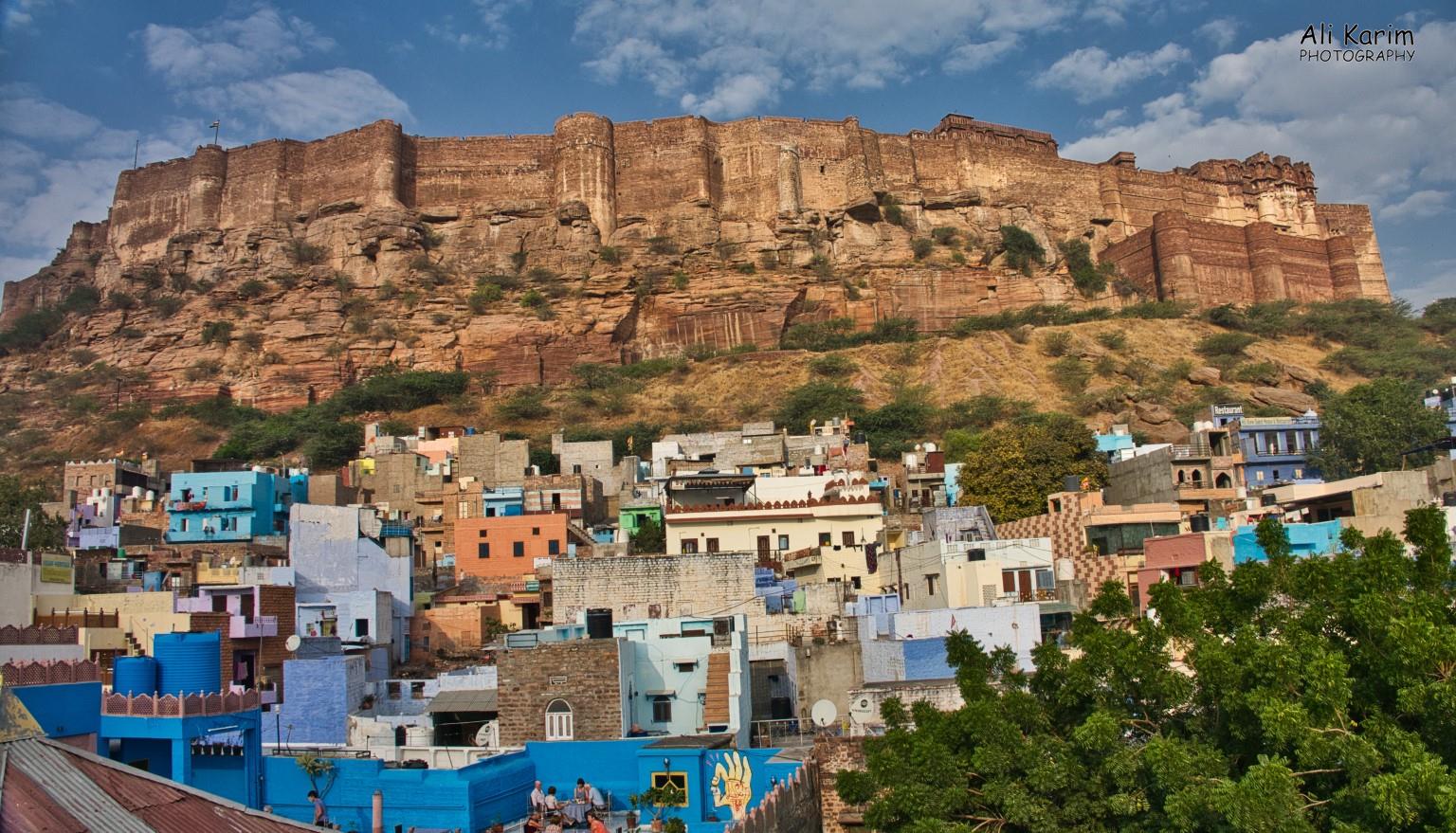 View of Mehranghar Fort from our B&B rooftop at breakfast. Note the multiple “blue” colored buildings. Jodhpur is known as the Blue City Jodhpur, Rajasthan View of Mehranghar Fort from our B&B rooftop at breakfast. Note the multiple “blue” colored buildings. Jodhpur is known as the Blue City
