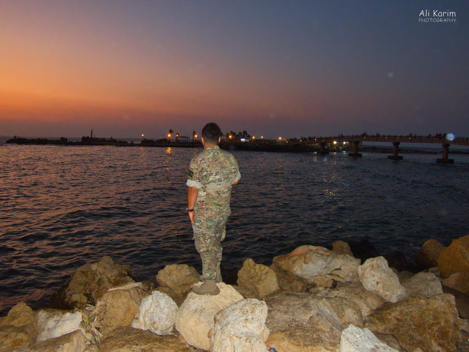 This soldier asked me to take his picture and send to him on WhatsApp; small island offshore linked by a bridge Beirut to Tripoli This soldier asked me to take his picture and send to him on WhatsApp; small island offshore linked by a bridge