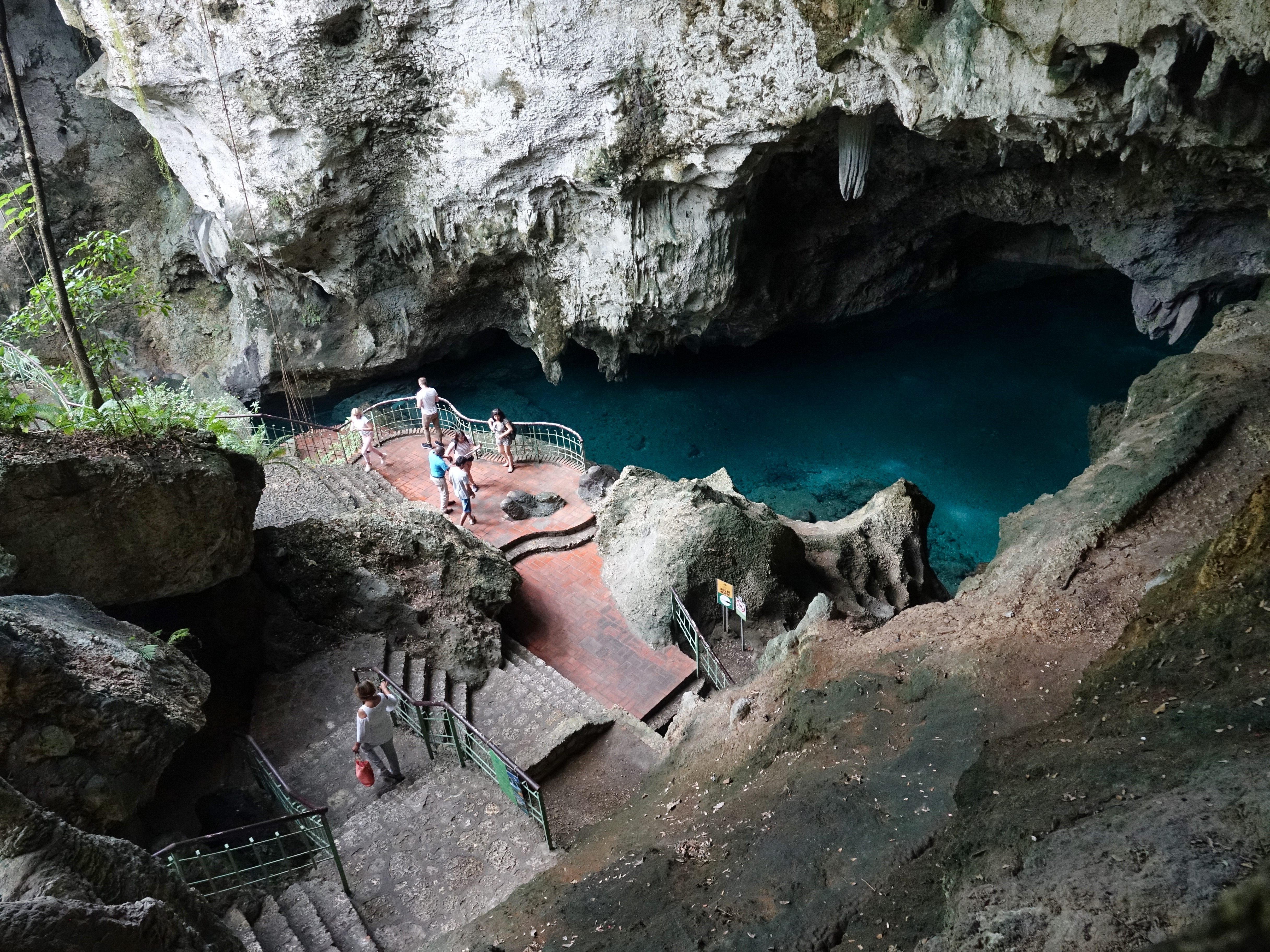 The blue is the fresh water cenote at the bottom of this open air cavern The blue is the fresh water cenote at the bottom of this open air cavern