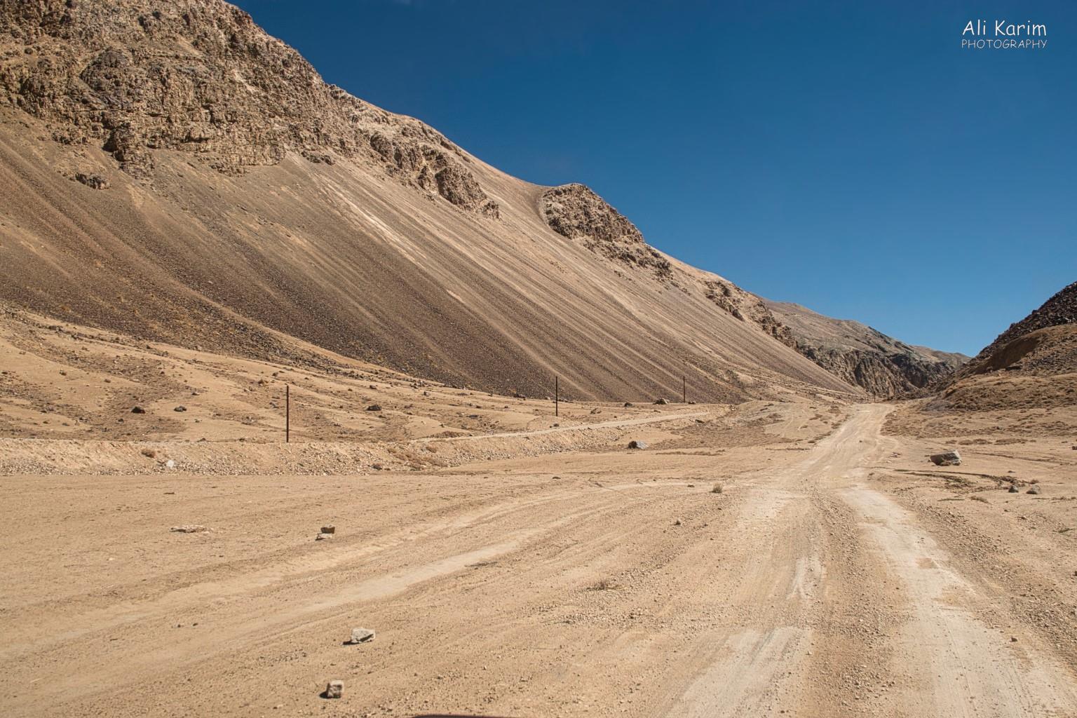 Road from Bulunkul back to the Pamir highway; unused electricity/telephone poles still standing Langar, Tajikistan, Road from Bulunkul back to the Pamir highway; unused electricity/telephone poles still standing