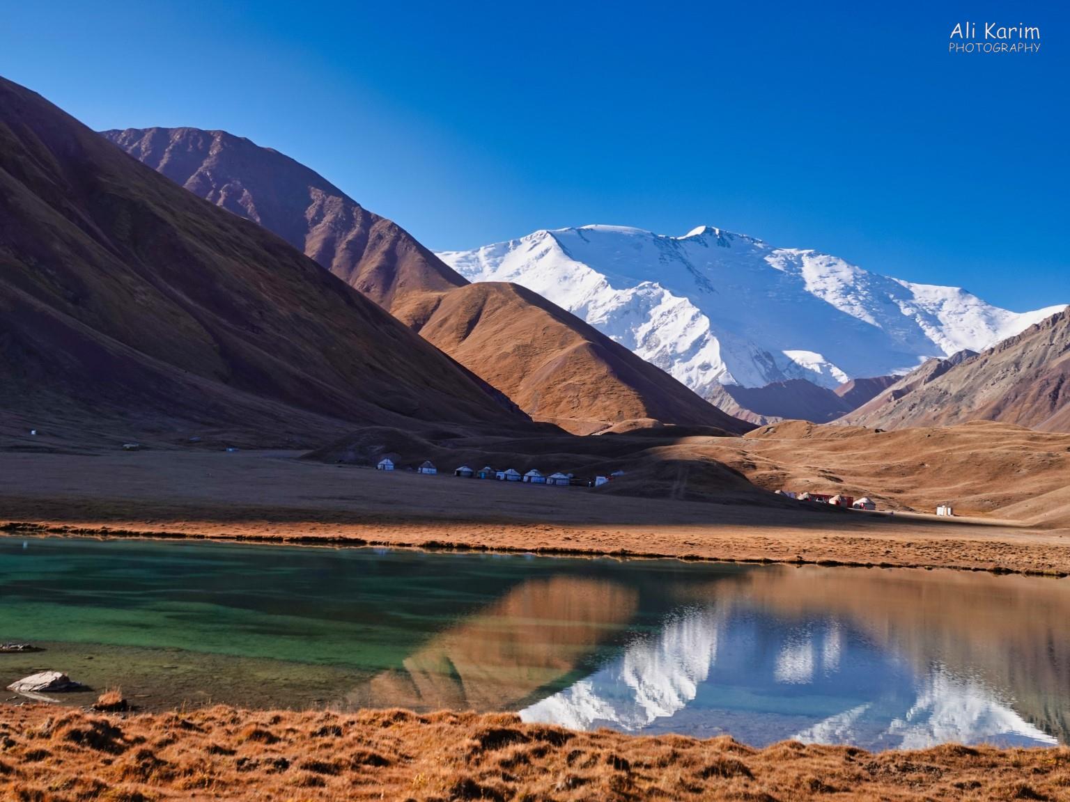 Silk Road 18: Murghab, Tajikistan Goodbye, Lenin Peak and Yurt Camp. Beautiful layers of reflections in Turpal kul lake….