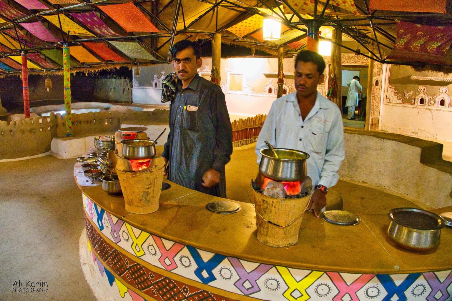 Food was served on typical pails with hot charcoals inside to keep the food hot Bhuj, Kutch, Gujarat Food was served on typical pails with hot charcoals inside to keep the food hot