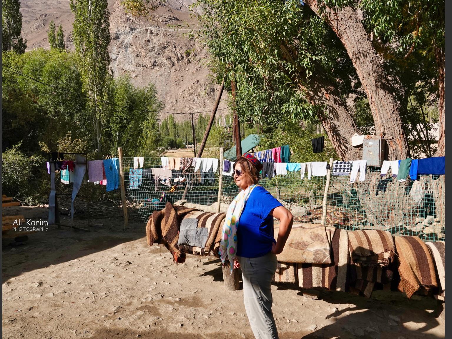 Courtyard; clothes and carpets all cleaned and drying. Note the landscape in the back Onto Khorog, Tajikistan, Courtyard; clothes and carpets all cleaned and drying. Note the landscape in the back