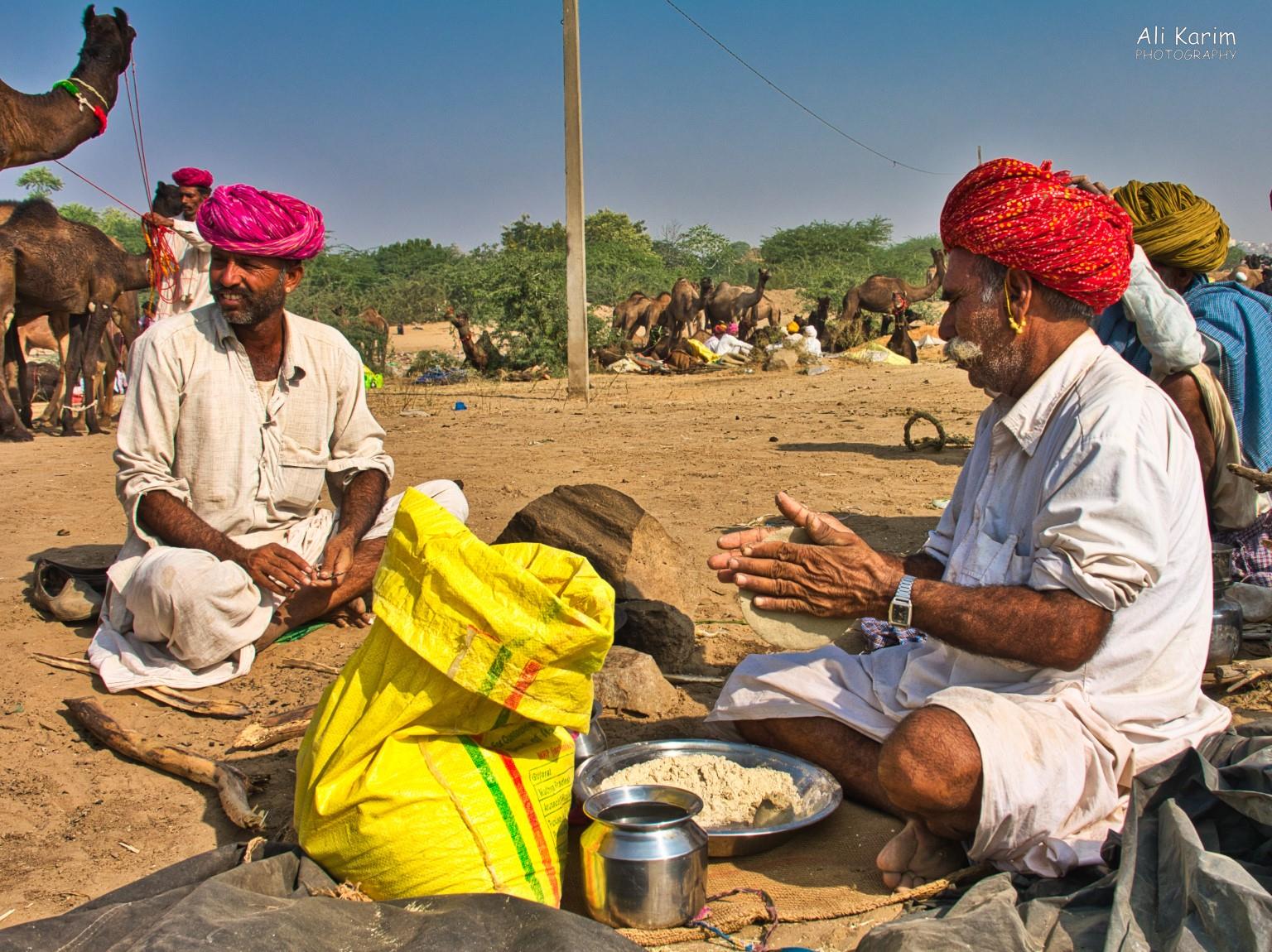 Making baajra roti’s on a campfire behind the yellow flour bag Pushkar, Rajasthan Making baajra roti’s on a campfire behind the yellow flour bag