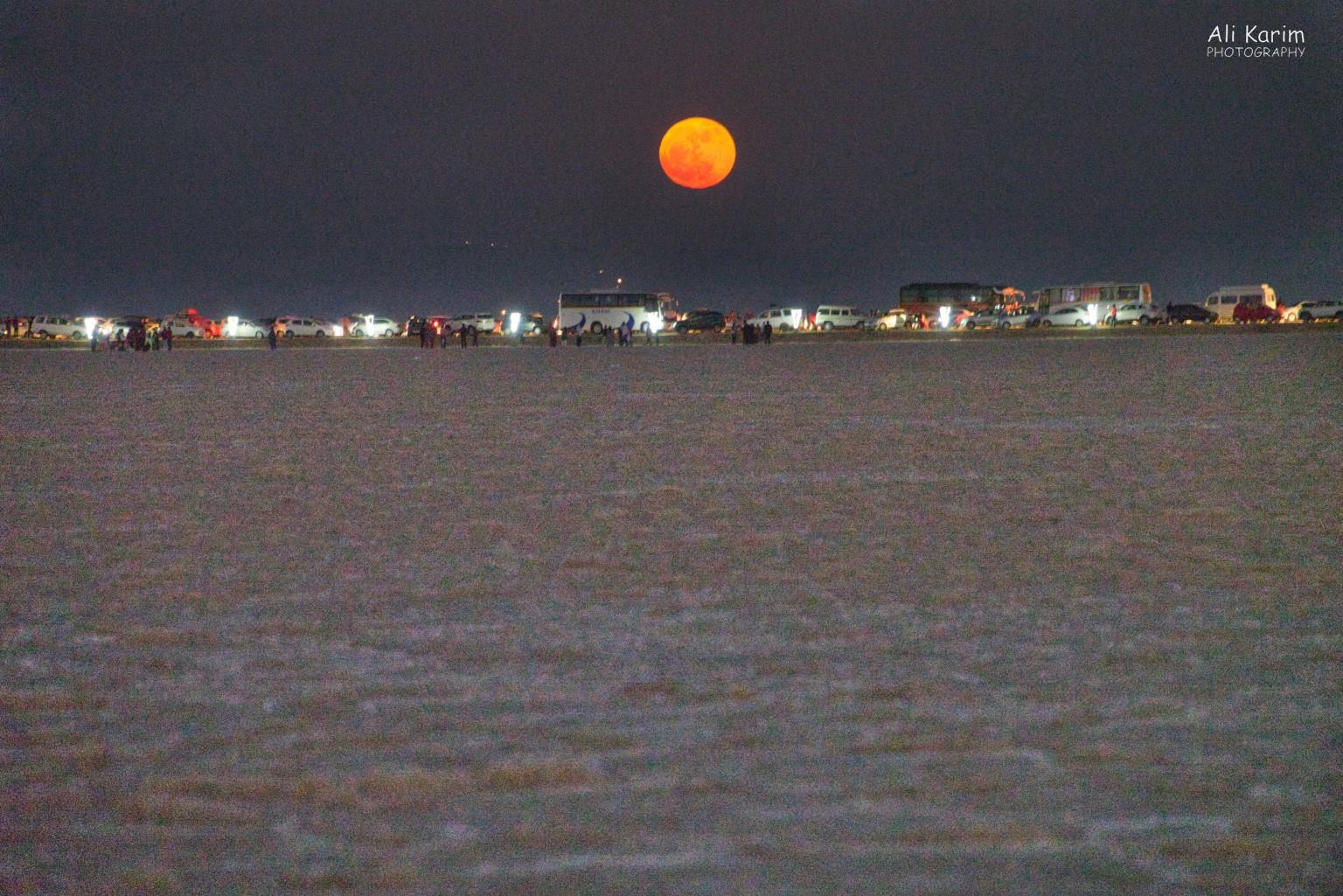followed by an equally beautiful moonrise over the Raan, shortly after the sunset. Timing was perfect. Note all the busy tourist transportation Bhuj, Kutch, Gujarat followed by an equally beautiful moonrise over the Raan, shortly after the sunset. Timing was perfect. Note all the busy tourist transportation