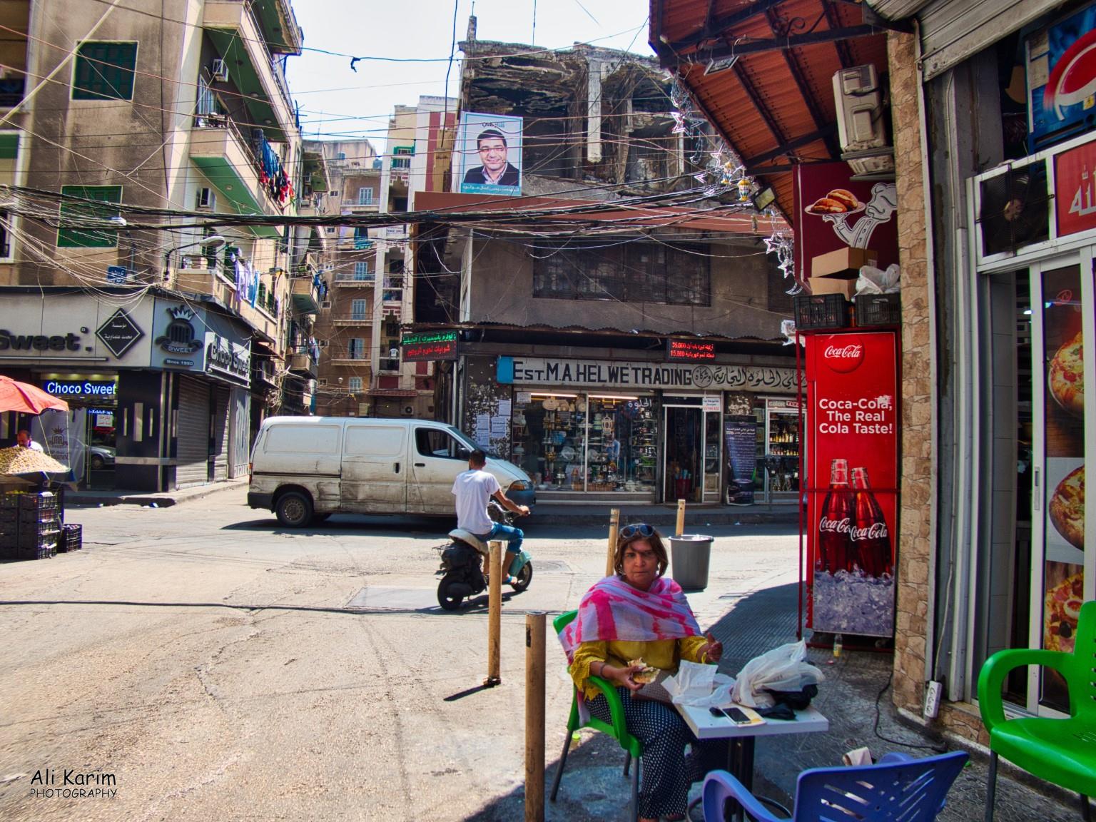 Lunch stop at bakery for Manouche and Zatar; patio dining. Note the bombed out building in the back that was not yet rebuilt Tripoli Lebanon Lunch stop at bakery for Manouche and Zatar; patio dining. Note the bombed out building in the back that was not yet rebuilt