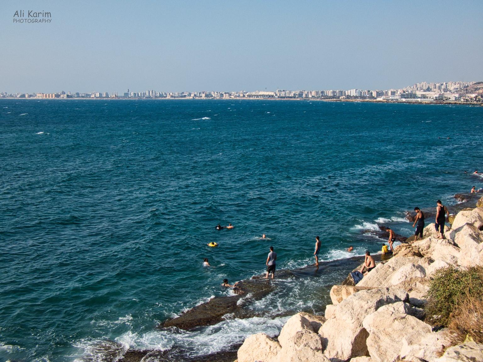 City of Tripoli, and bathers enjoying the sea from the flat rocks in the water Beirut to Tripoli City of Tripoli, and bathers enjoying the sea from the flat rocks in the water