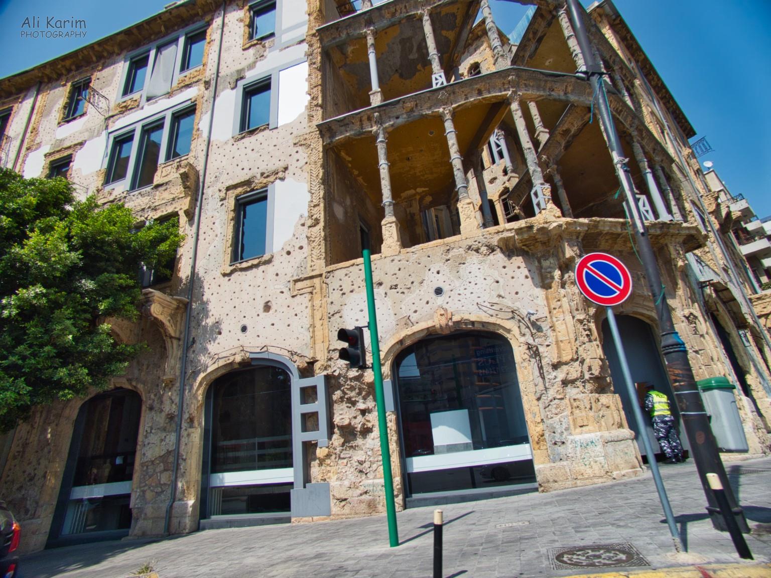 Was ravaged building, that was partially fixed up, and in use. Note the bullet holes Was ravaged building, that was partially fixed up, and in use. Note the bullet holes