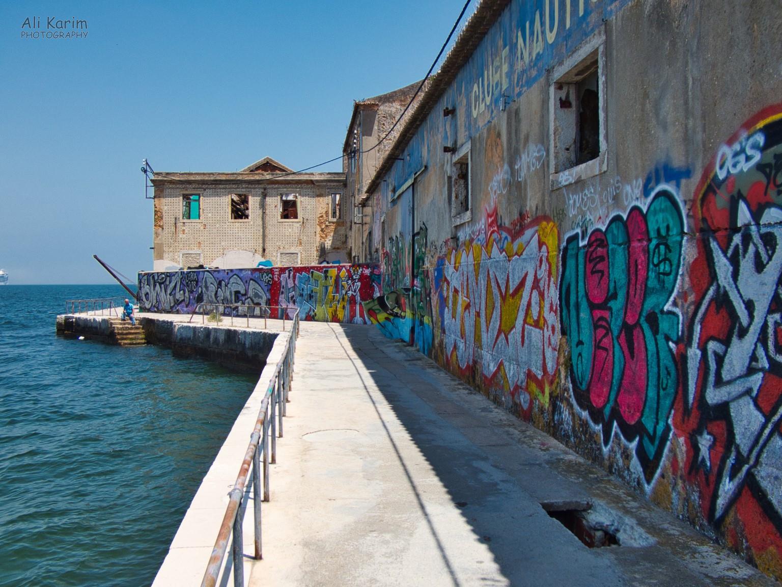 Old, disused and decaying wharf with colorful graffiti Old, disused and decaying wharf with colorful graffiti
