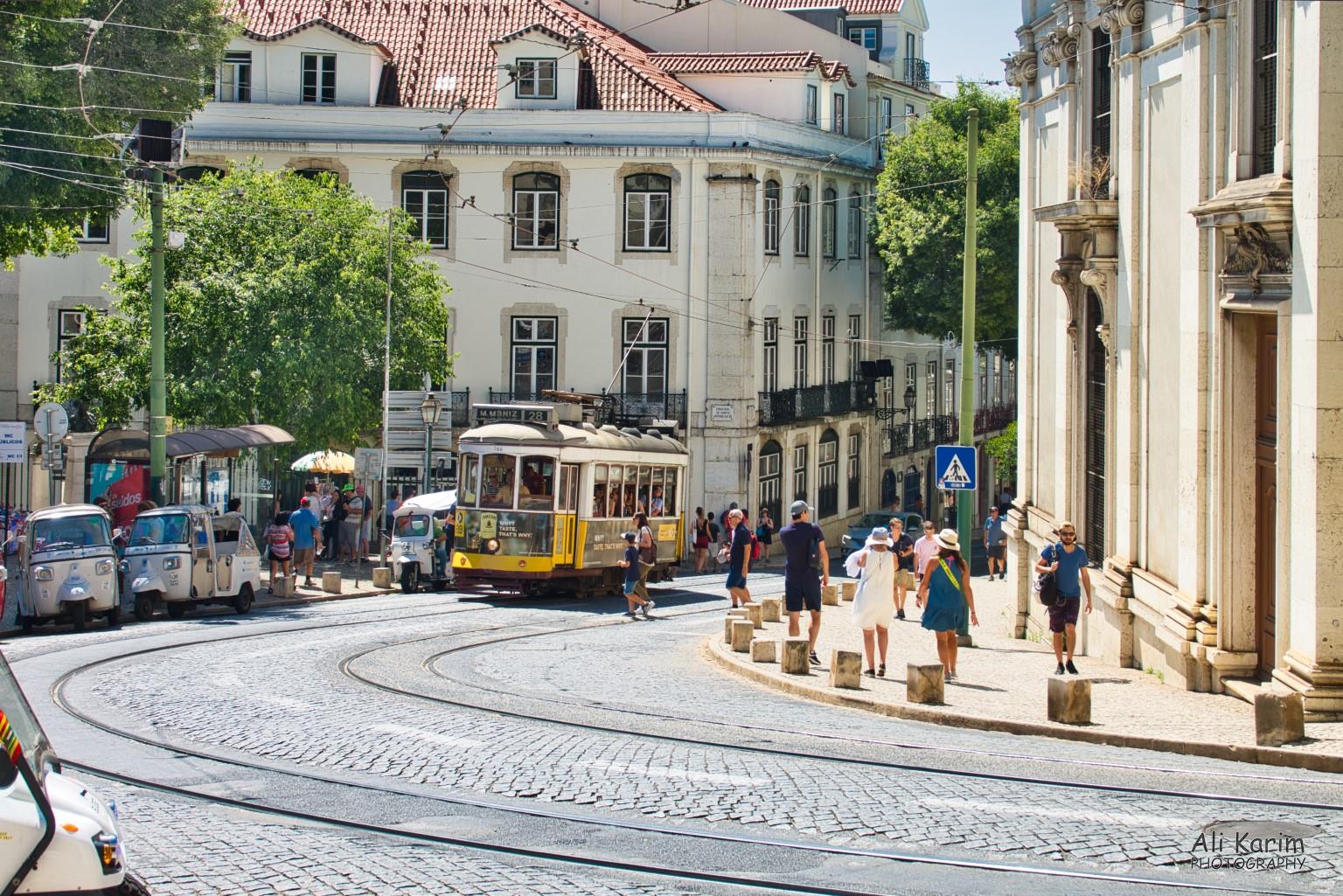Lisbon Portugal: Alfama and Tram 28; outside the Lisbon Cathedral (Sé de Lisboa). Tuk-tuks were also popular with tourists