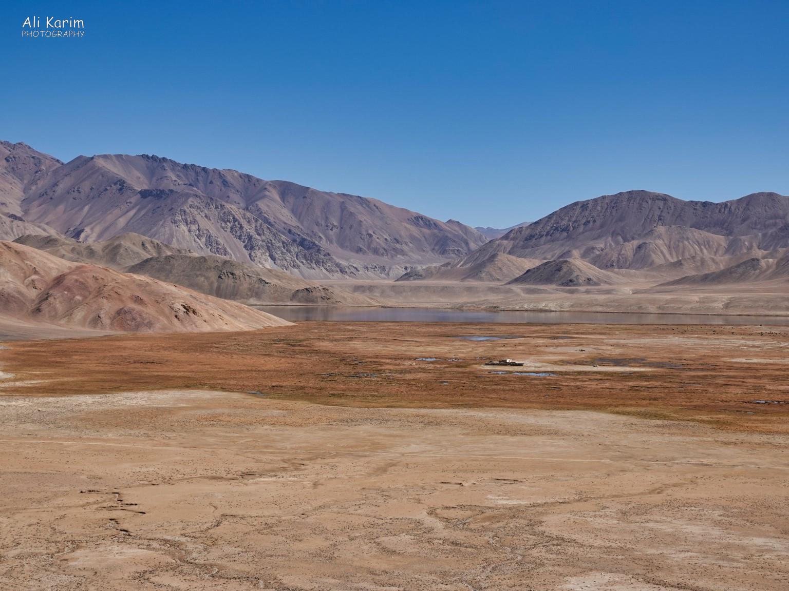 Soon we arrived at Bulunkul; a small freshwater lake that was stocked with carp fish during the Soviet times. Langar, Tajikistan, Soon we arrived at Bulunkul; a small freshwater lake that was stocked with carp fish during the Soviet times.