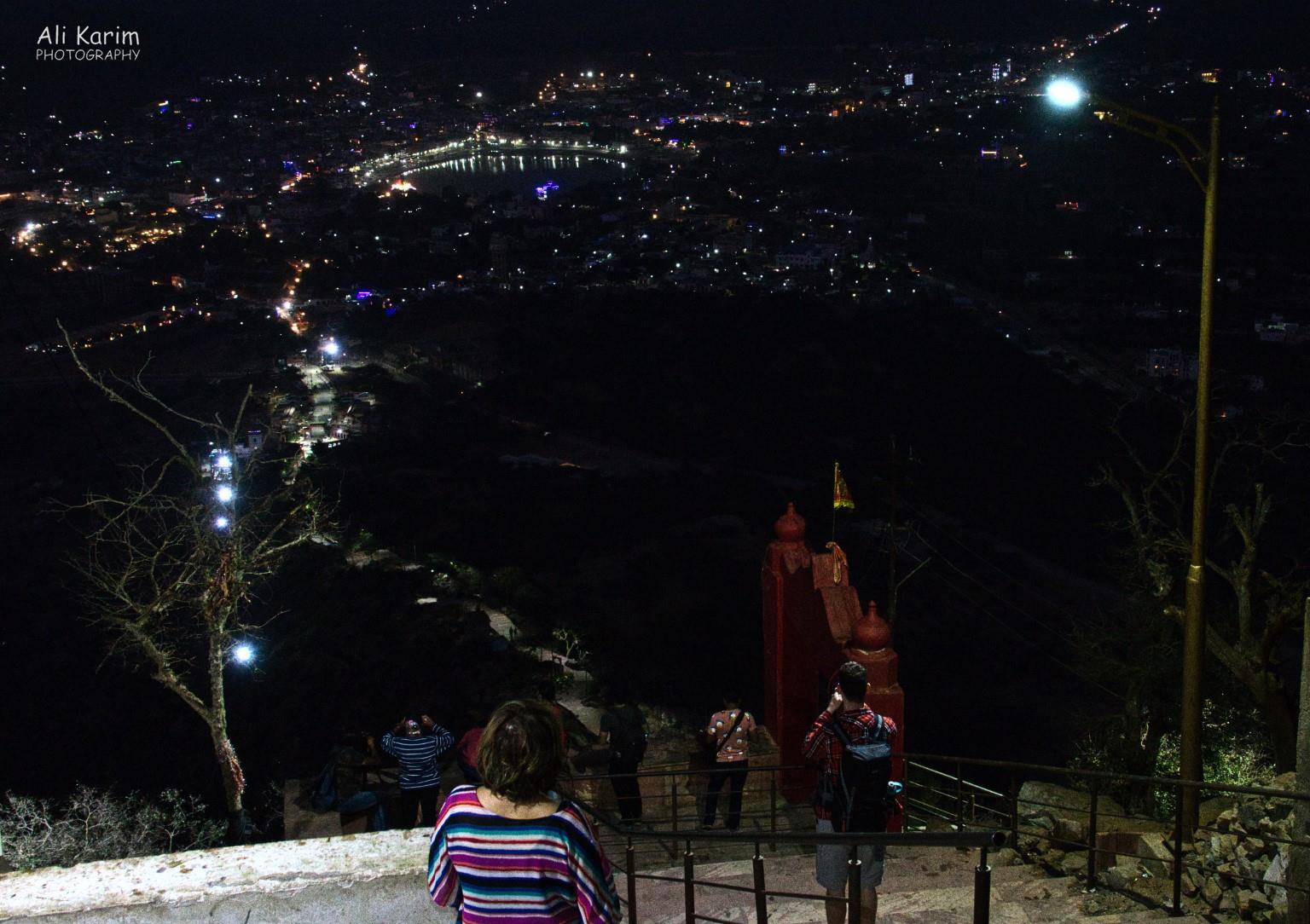Night view of the lighted pathway down from the Savitri temple, as well as Pushkar Lake and town Pushkar, Rajasthan Night view of the lighted pathway down from the Savitri temple, as well as Pushkar Lake and town