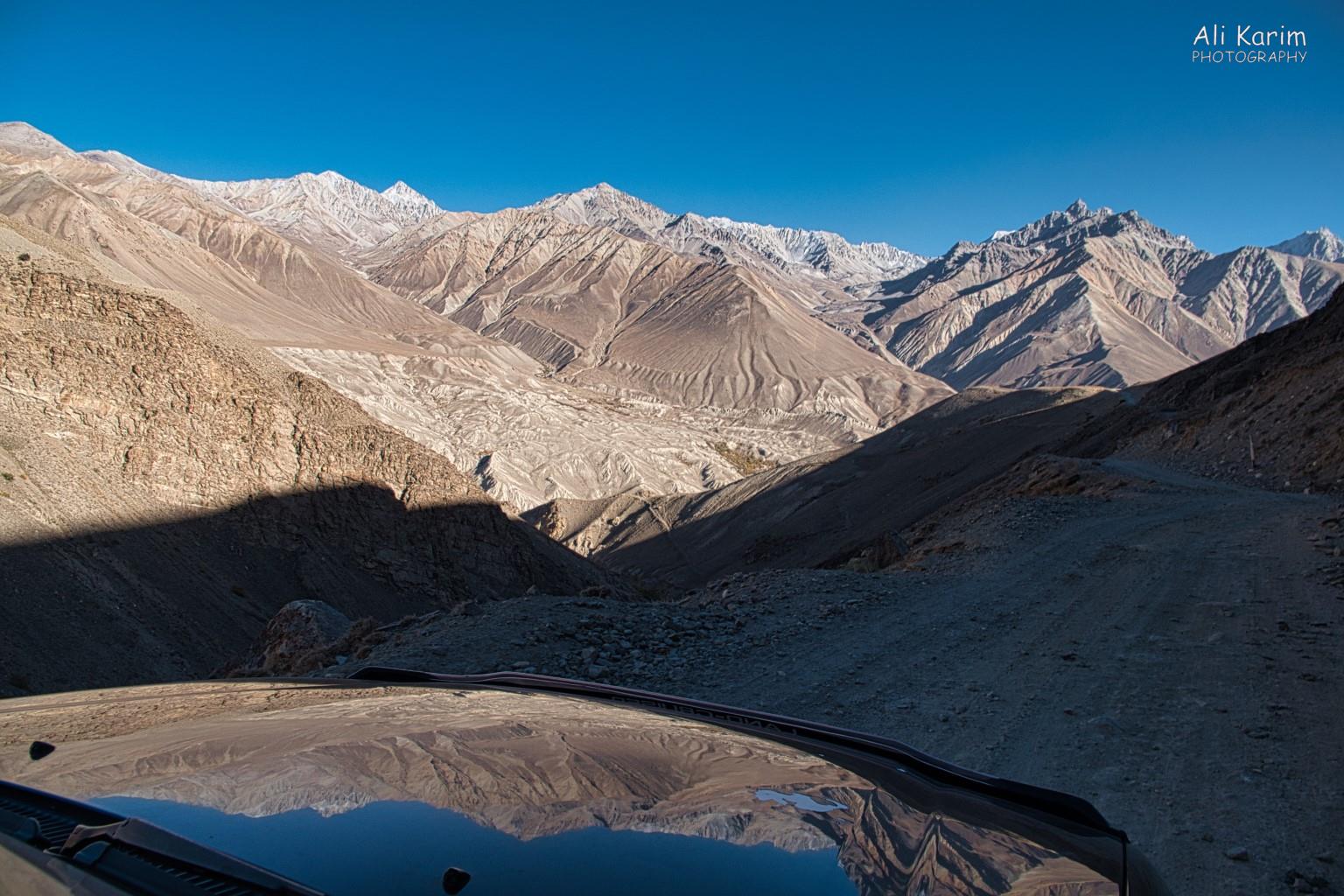 Spectacular Pamir mountains on Afghan side, reflected on our hood Langar, Tajikistan, Spectacular Pamir mountains on Afghan side, reflected on our hood