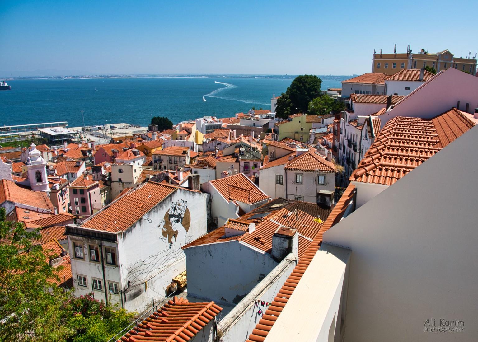 Another Miradouro of Lisbon and zig-zag ferries; note the wall mural on the building in foreground Lisbon Portugal: Another Miradouro of Lisbon and zig-zag ferries; note the wall mural on the building in foreground