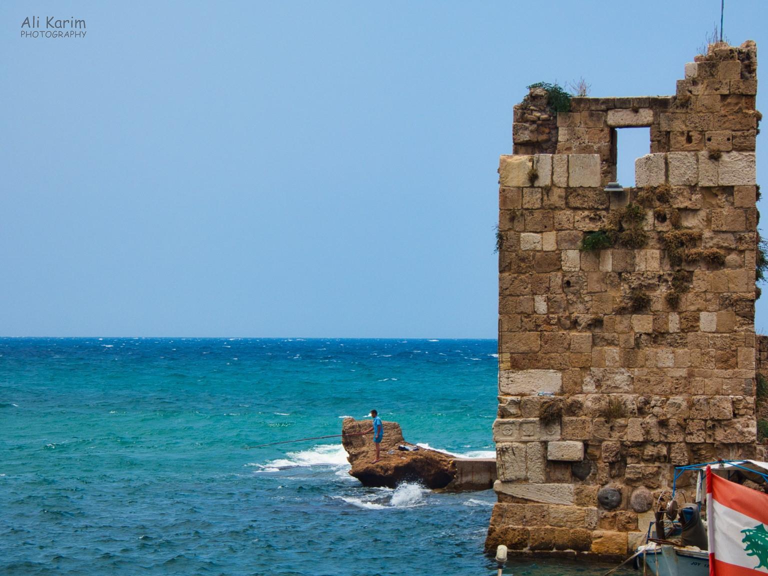 Fortification guarding the harbor entrance from the olden times, lone fisherman Beirut to Tripoli Fortification guarding the harbor entrance from the olden times, lone fisherman