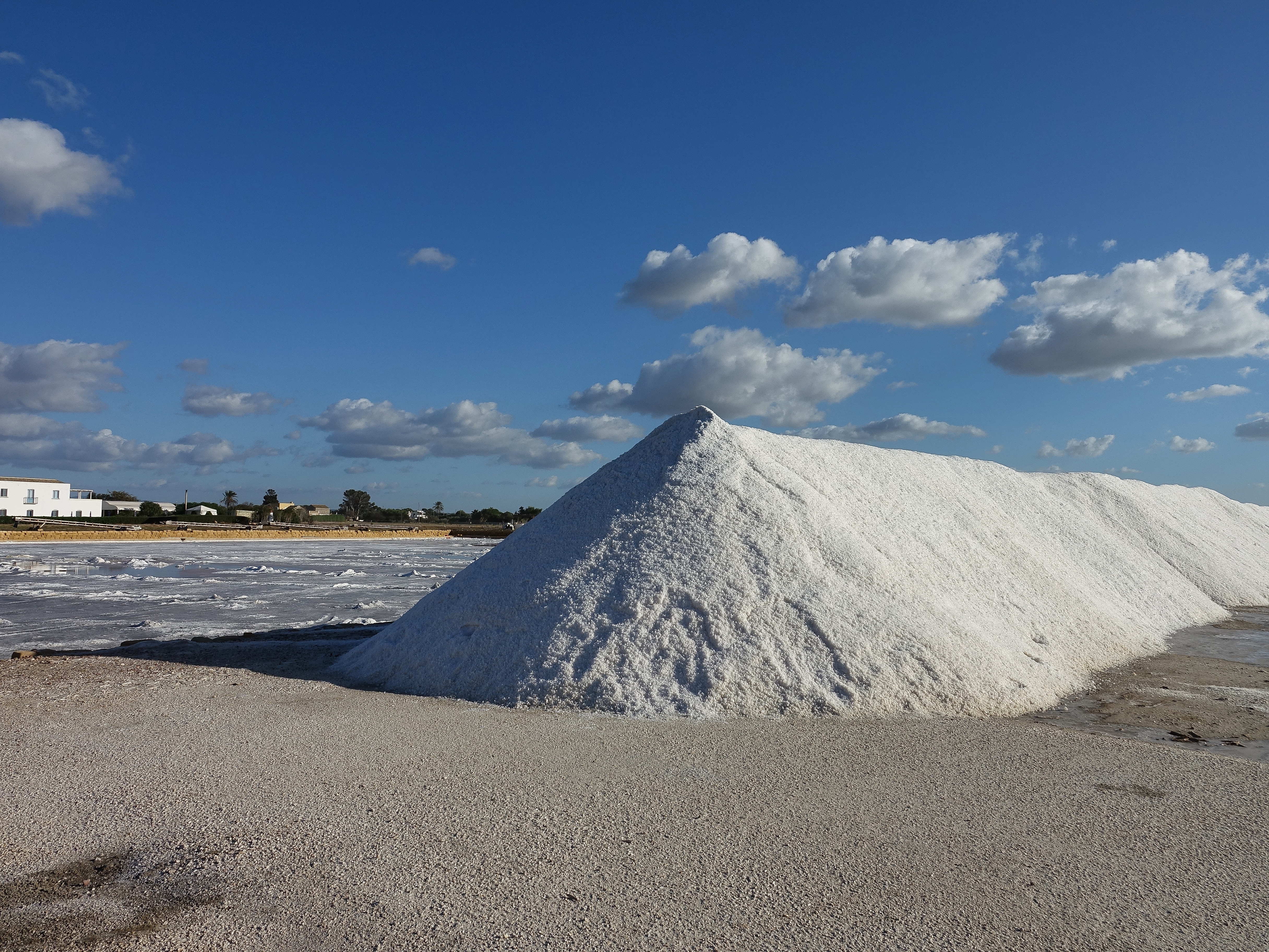 Sea salt harvest ready for processing, from the salt pond on left Sea salt harvest ready for processing, from the salt pond on left
