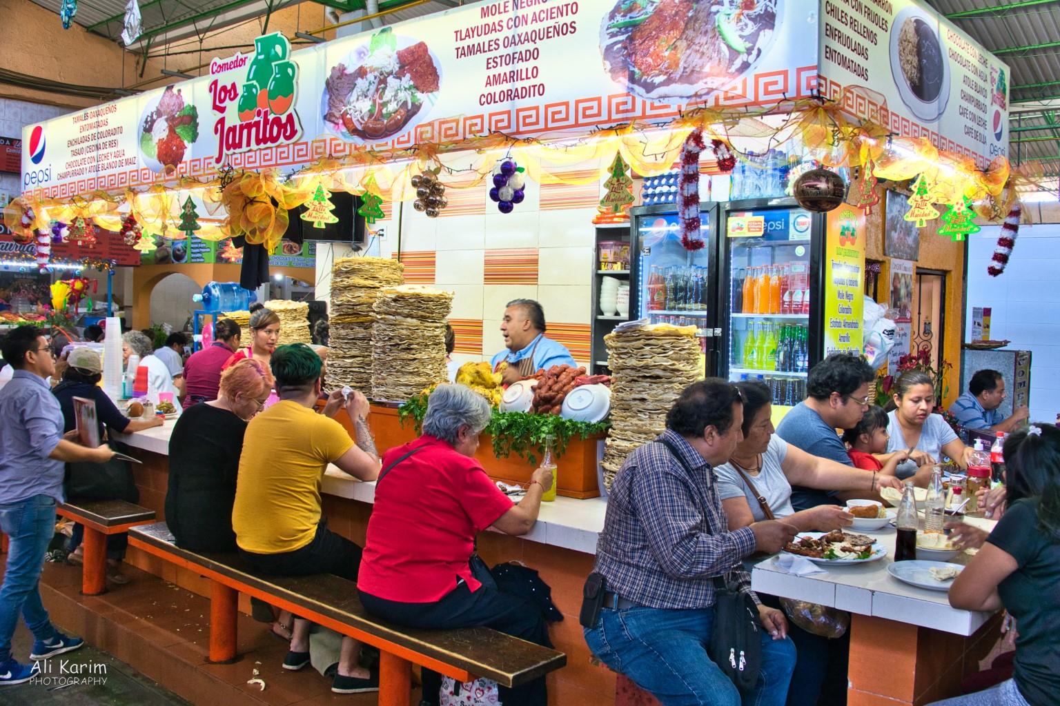 Very nice and clean eating places in the markets; note the stack of Tlayudas tortilla’s Oaxaca, Mexico Very nice and clean eating places in the markets; note the stack of Tlayudas tortilla’s