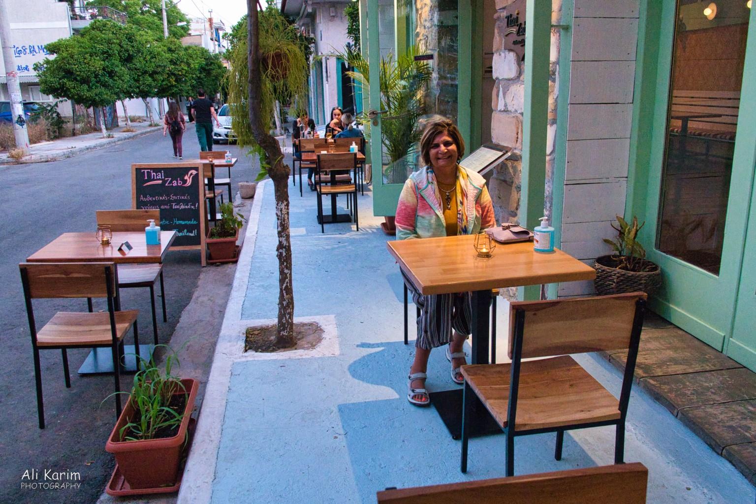 Streetside dining away from touristy areas Athens, Greece, June, 2021, Streetside dining away from touristy areas