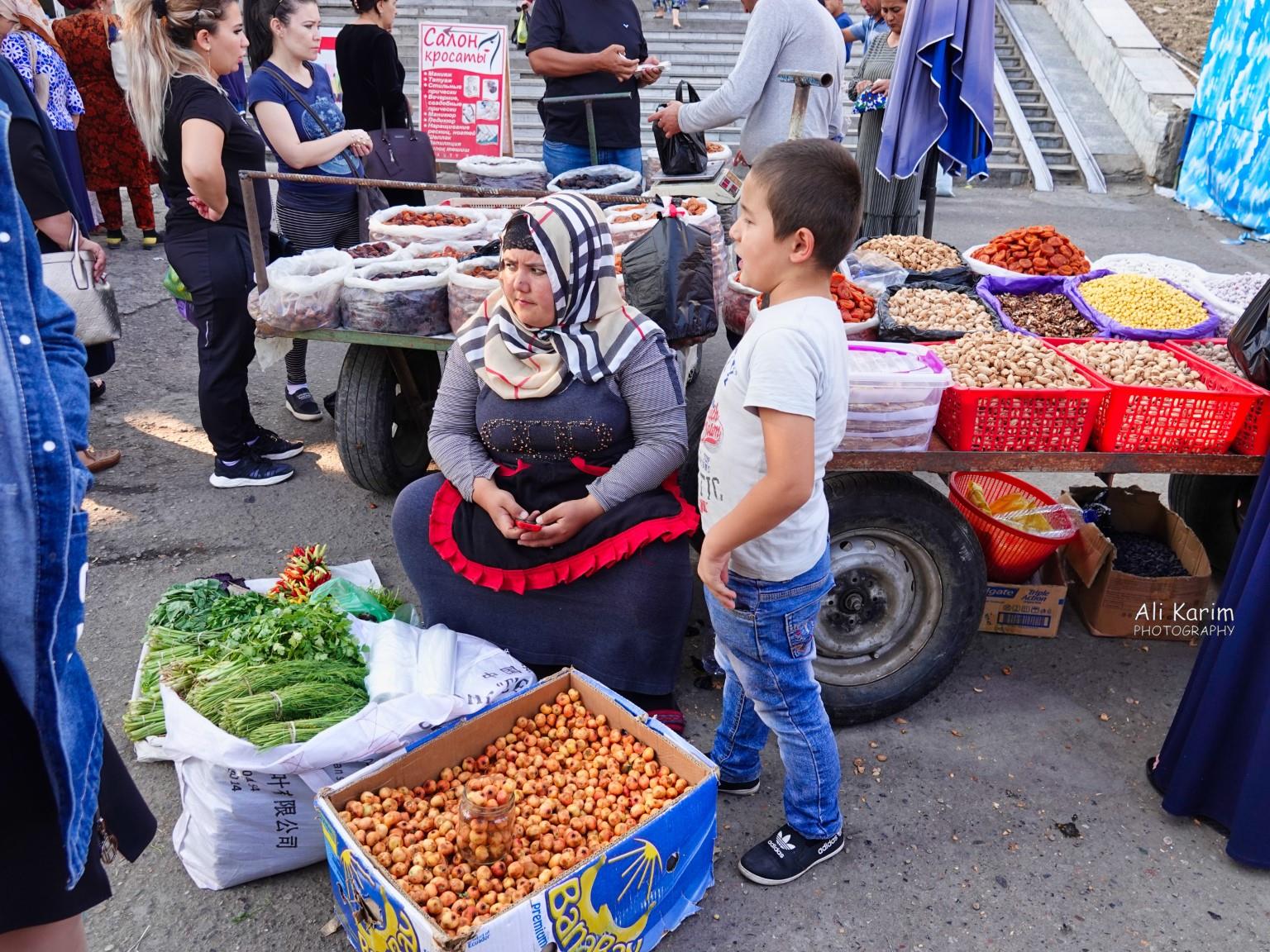 Tashkent, Oct 2019, Mother & son selling vegetables and nuts