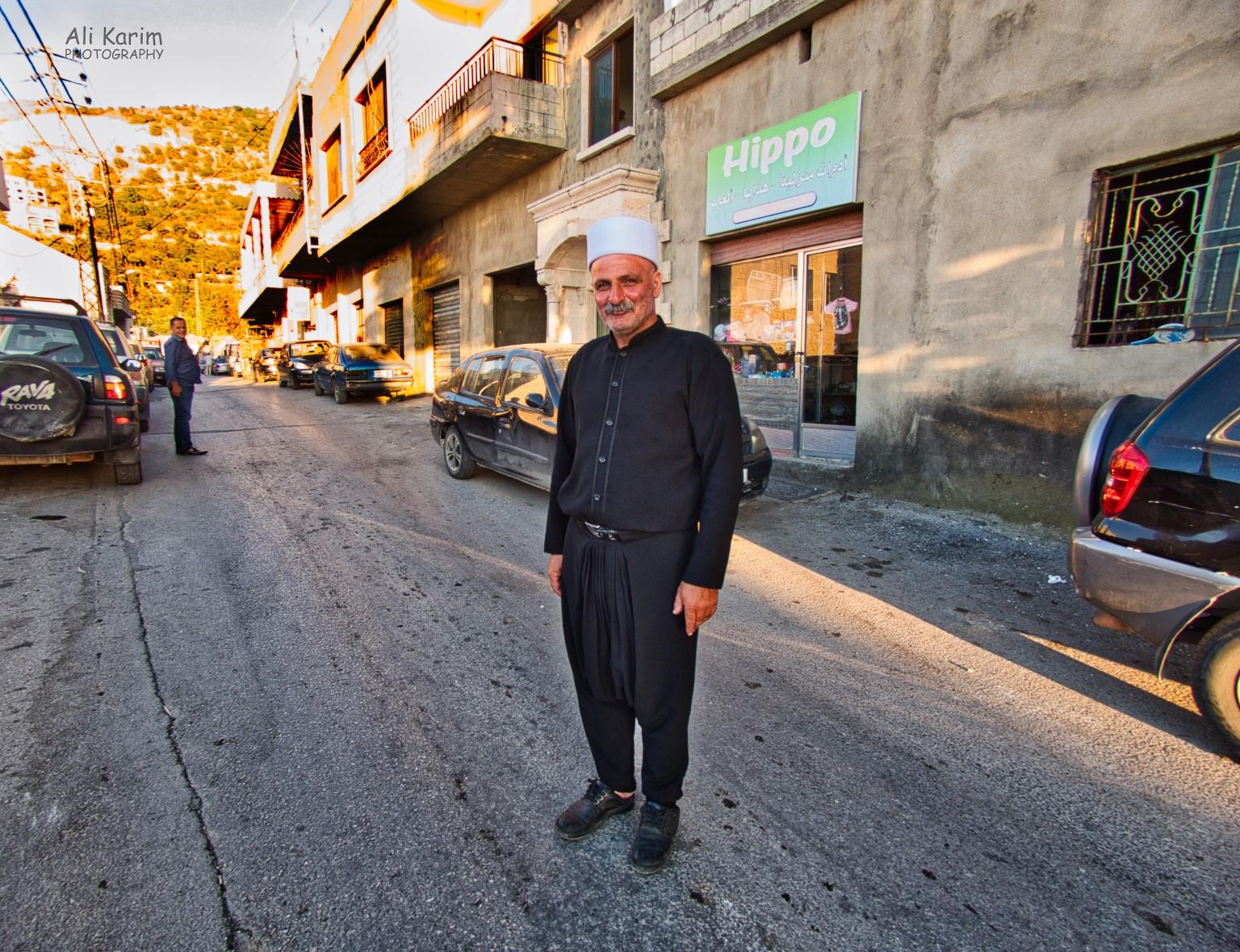 Friendly gentleman, traditionally dressed in black harem pants, shirt and white hat; who guided us away from the Druze mosque Bekaa Valley Winery, Chouf Mountains & the Druze Friendly gentleman, traditionally dressed in black harem pants, shirt and white hat; who guided us away from the Druze mosque
