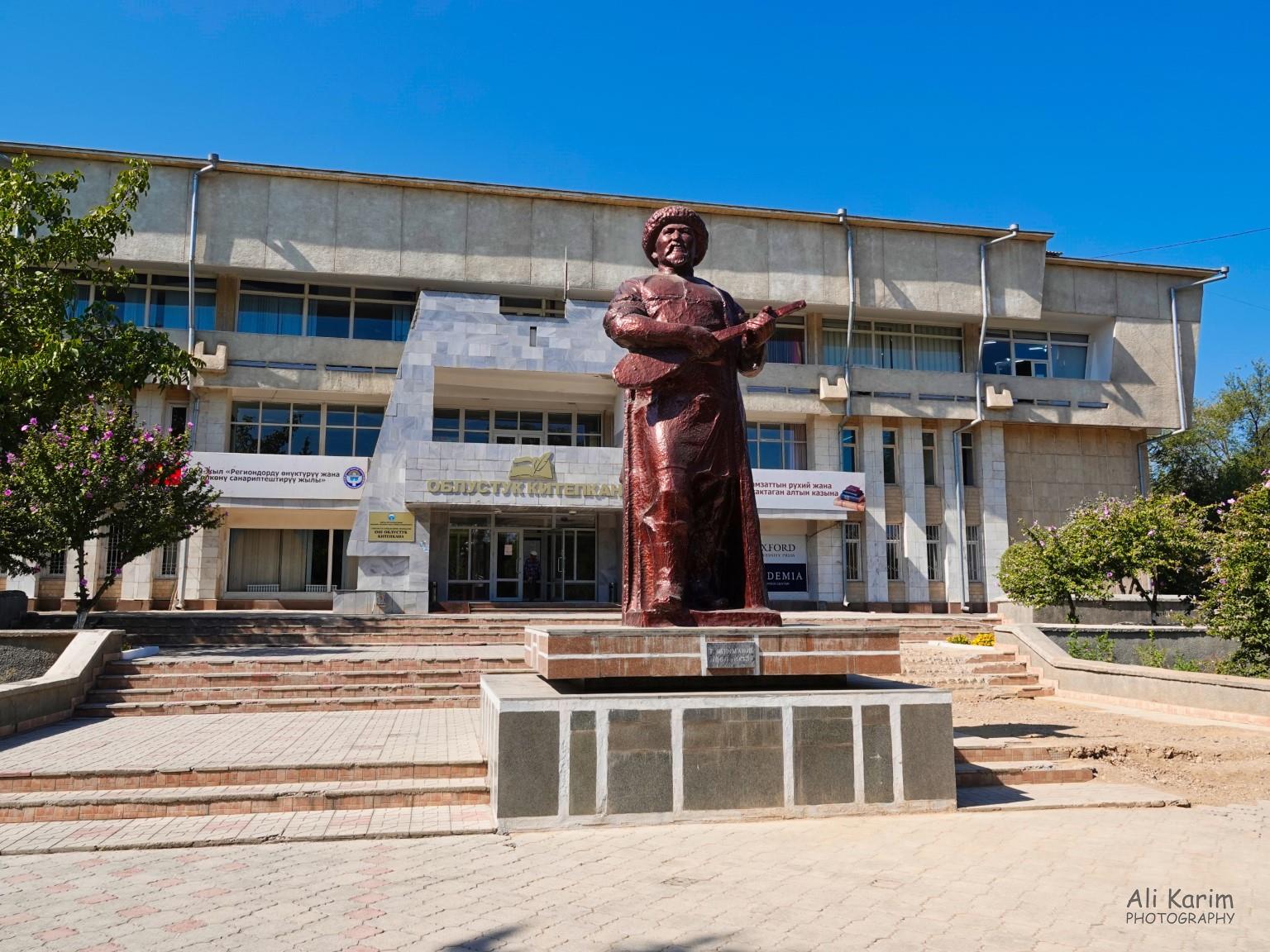 Osh National library, and statue of a famous Kyrgyz poet and musician. Inside the library was the American Corner Silk Road 16: More Osh, Kyrgyzstan Osh National library, and statue of a famous Kyrgyz poet and musician. Inside the library was the American Corner