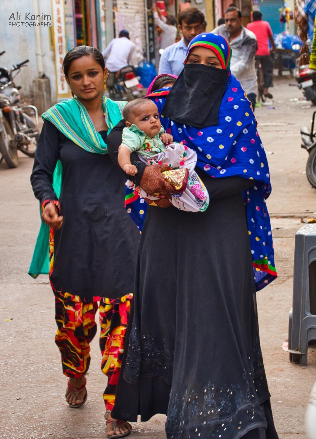 Baby and mother; note the henna on the mothers hand More Bhuj Baby and mother; note the henna on the mothers hand
