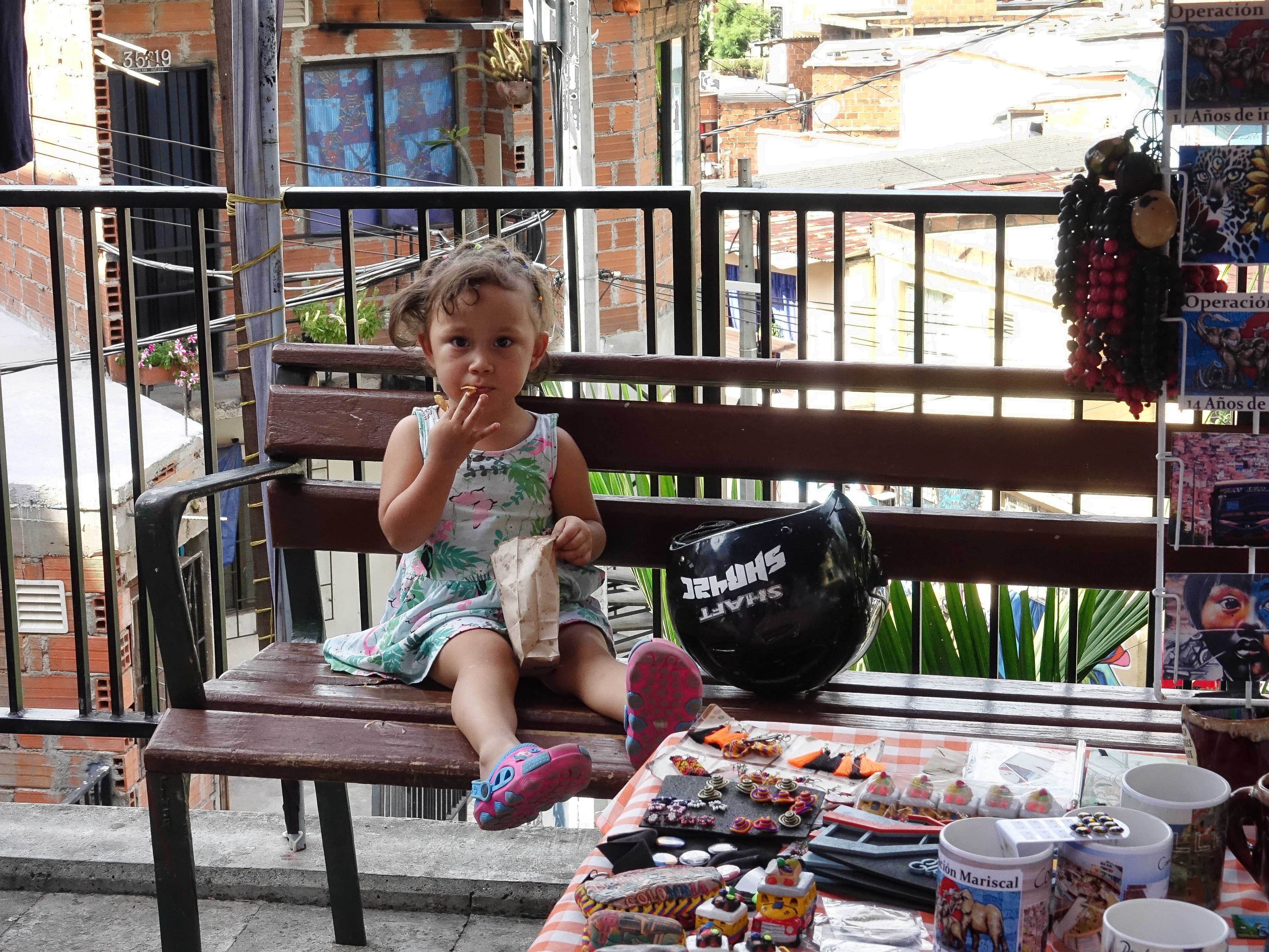 I had to buy a Communa 13 cap from this young lady at the foot of one of the Escalera’s I had to buy a Communa 13 cap from this young lady at the foot of one of the Escalera’s