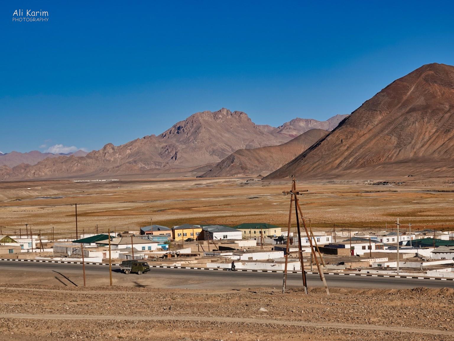 Dusty town of Murghab on a flat plain in the Pamir mountains More Murghab & Alichur, Tajikistan, Dusty town of Murghab on a flat plain in the Pamir mountains