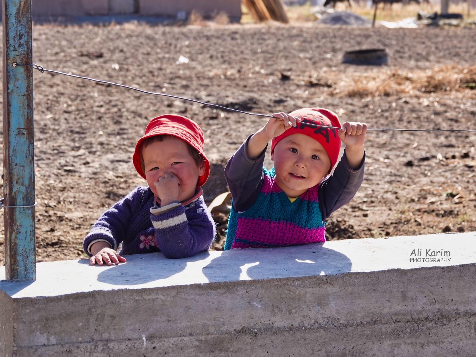 Youngsters enjoying the morning sun, and checking out us visitors Silk Road 18: Murghab, Tajikistan Youngsters enjoying the morning sun, and checking out us visitors