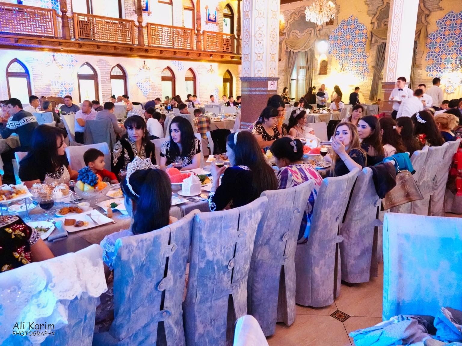 Many tables with well-dressed ladies in the large hall, with private rooms for dining along the edges and upstairs Samarkand, Uzbekistan Many tables with well-dressed ladies in the large hall, with private rooms for dining along the edges and upstairs