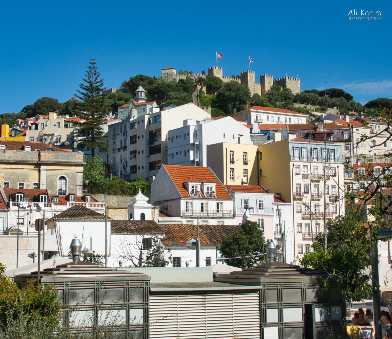 View of the Moors Castle (Castelo de São Jorge) on the hilltop above Lisbon from Martim Moniz barrio Lisbon Portugal: View of the Moors Castle (Castelo de São Jorge) on the hilltop above Lisbon from Martim Moniz barrio