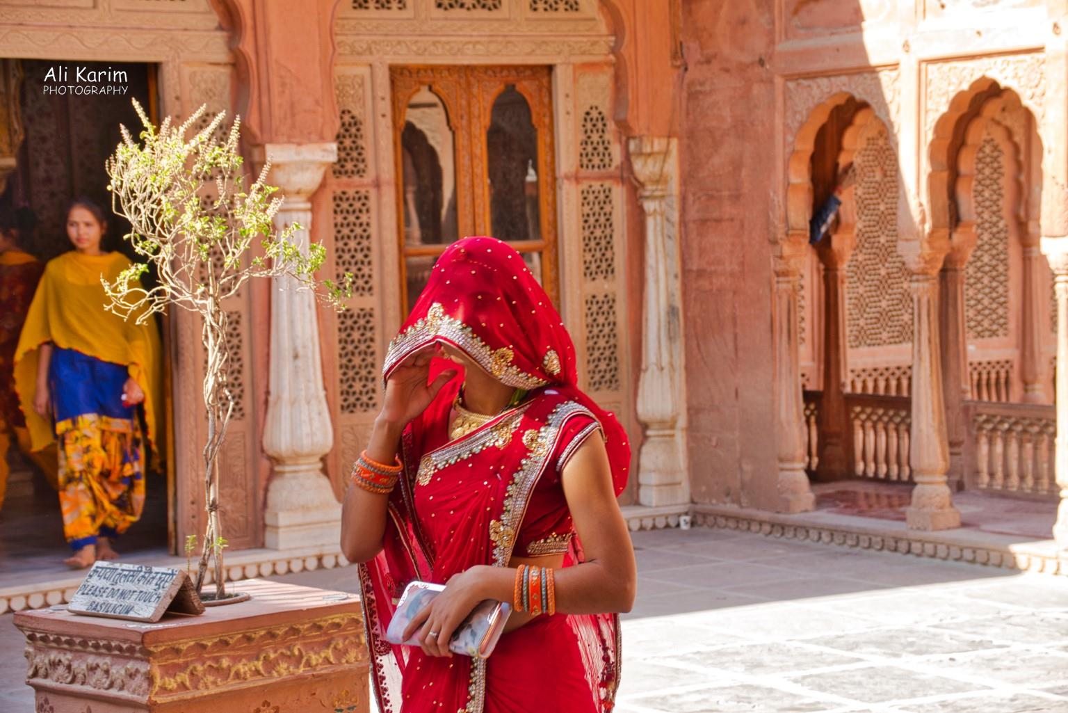 Palace grounds; many Rajasthani women covered their faces with their sari’s to keep away evil gazes Bikaner, Rajasthan Palace grounds; many Rajasthani women covered their faces with their sari’s to keep away evil gazes