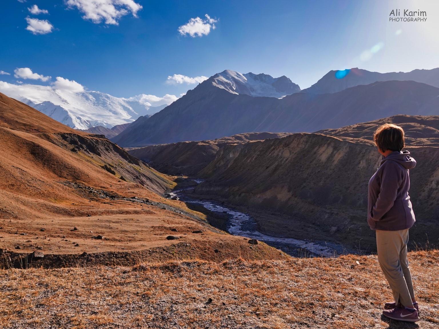 Admiring nature at high altitude. These Pamir-Alay mountain range formed the border of Kyrgyzstan and Tajikistan Silk Road 16: More Osh, Kyrgyzstan Admiring nature at high altitude. These Pamir-Alay mountain range formed the border of Kyrgyzstan and Tajikistan