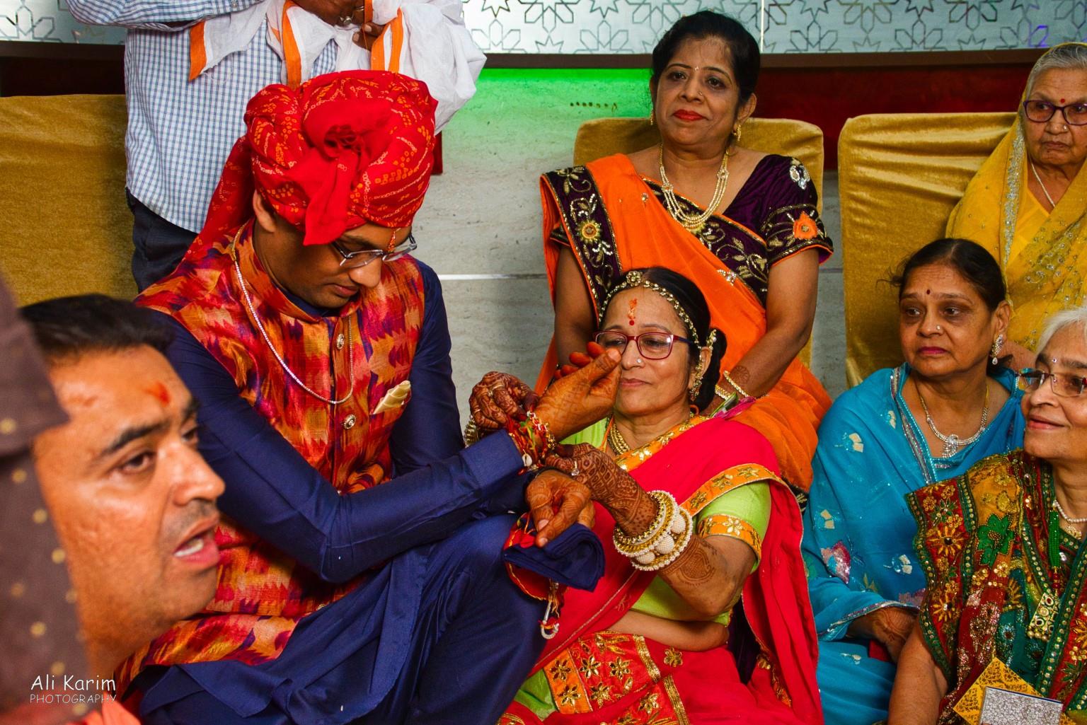 Gifts from the future mother-in-law; note the colors, jewelry, and the mehendi on the groom’s & mother-in-law’s hands Bikaner, Rajasthan Gifts from the future mother-in-law; note the colors, jewelry, and the mehendi on the groom’s & mother-in-law’s hands