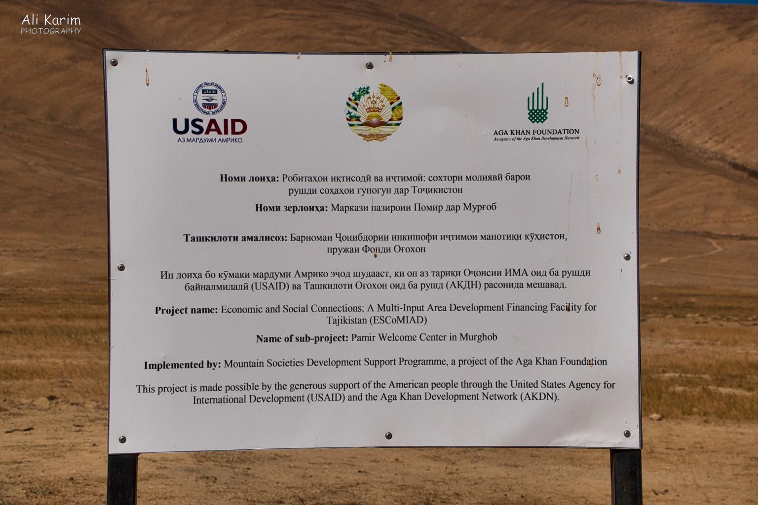 Langar, Tajikistan, Closer look at the sign at the entrance; this Entryway was financed and set up by USAID and AKDN