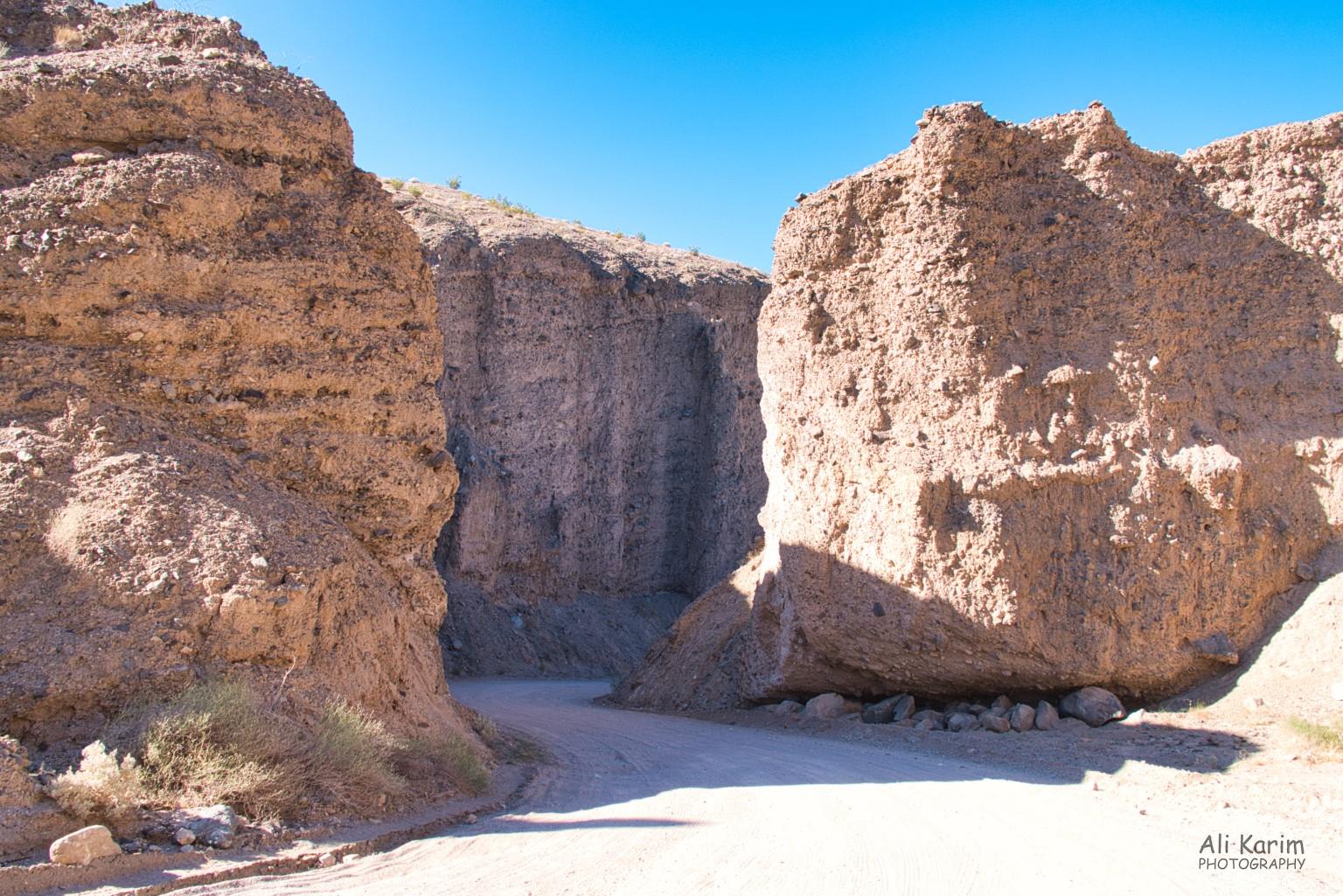 Road in canyons carved by flash floods in soft sandstone Death Valley National Park, June 2020, Road in canyons carved by flash floods in soft sandstone