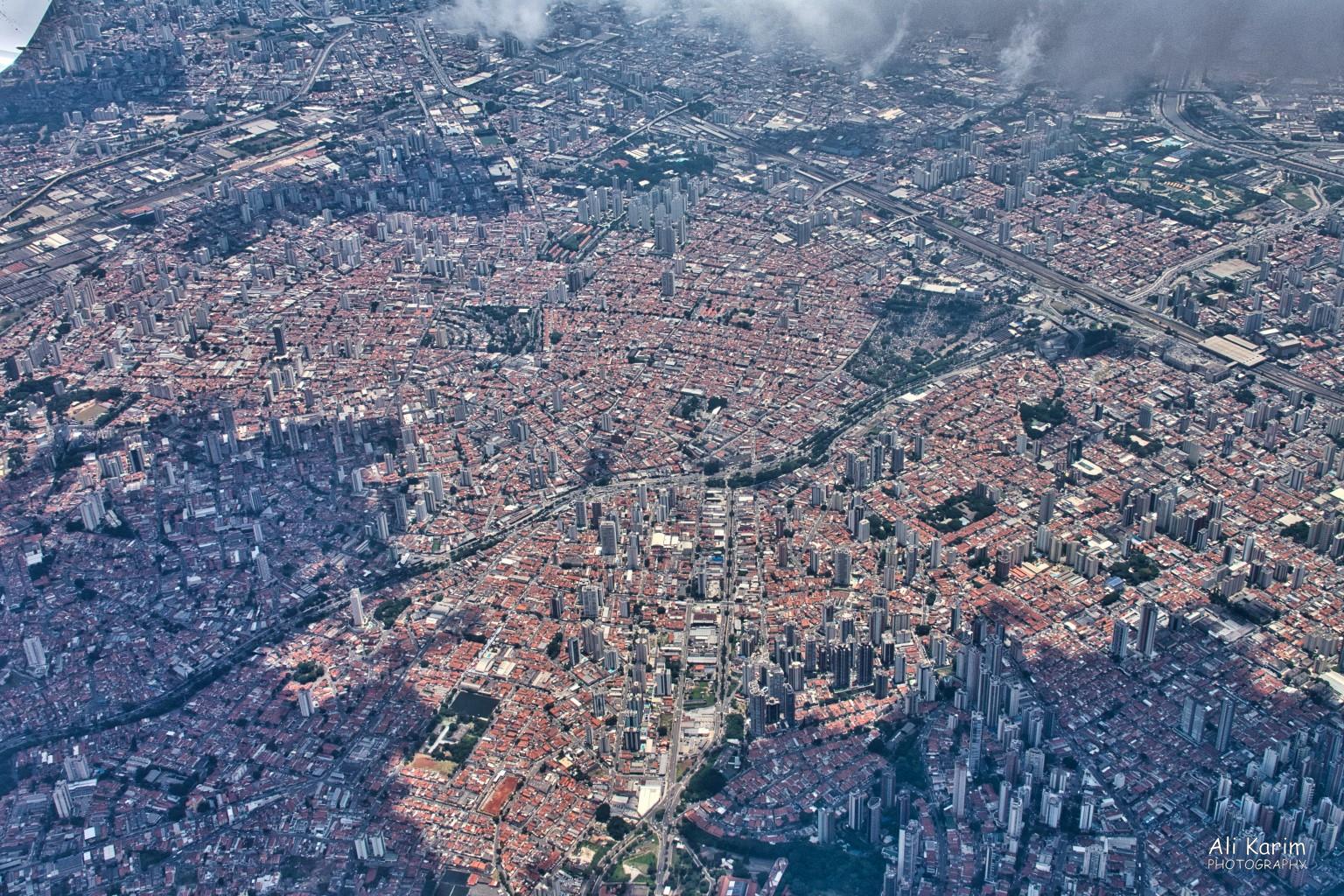 São Paulo as seen on the flight from São Paulo to Floripa. The shaded area due to clouds makes for an interesting picture. This type of dense urban space went on for miles. Florianópolis, Brazil São Paulo as seen on the flight from São Paulo to Floripa. The shaded area due to clouds makes for an interesting picture. This type of dense urban space went on for miles.