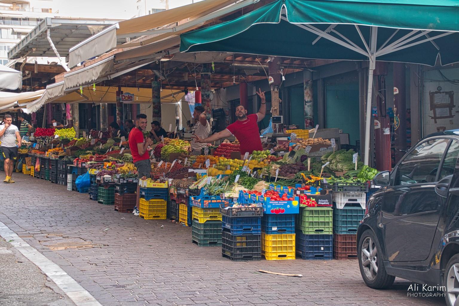 Fresh produce and jolly salespeople More Athens, Greece, May 2021, Fresh produce and jolly salespeople