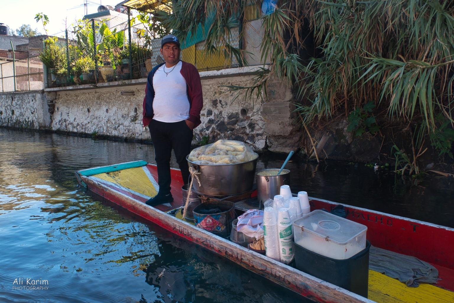 Vendor boats plied the waterways selling everything from cerveza to all kinds of foods, fruits, flowers, trinkets etc Mexico City, Mexico, Dec 2019, Vendor boats plied the waterways selling everything from cerveza to all kinds of foods, fruits, flowers, trinkets etc