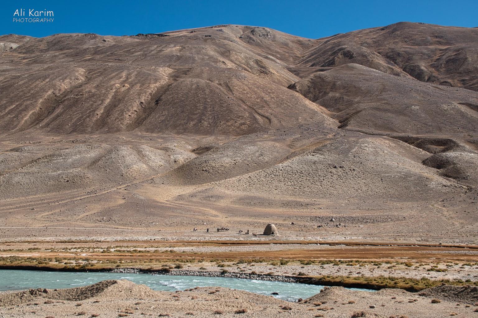 Caravan and Caravanserai in the harsh landscape; perspective Langar, Tajikistan, Caravan and Caravanserai in the harsh landscape; perspective