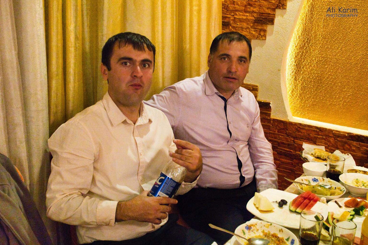 Masrur on right and his friend took good care of me at their table Onto Khorog, Tajikistan, Masrur on right and his friend took good care of me at their table