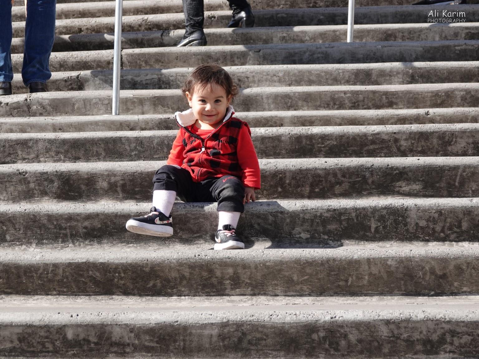 Mexico City, Mexico, Dec 2019, One happy camper enjoying the sun on the steps to the Soumaya Museum
