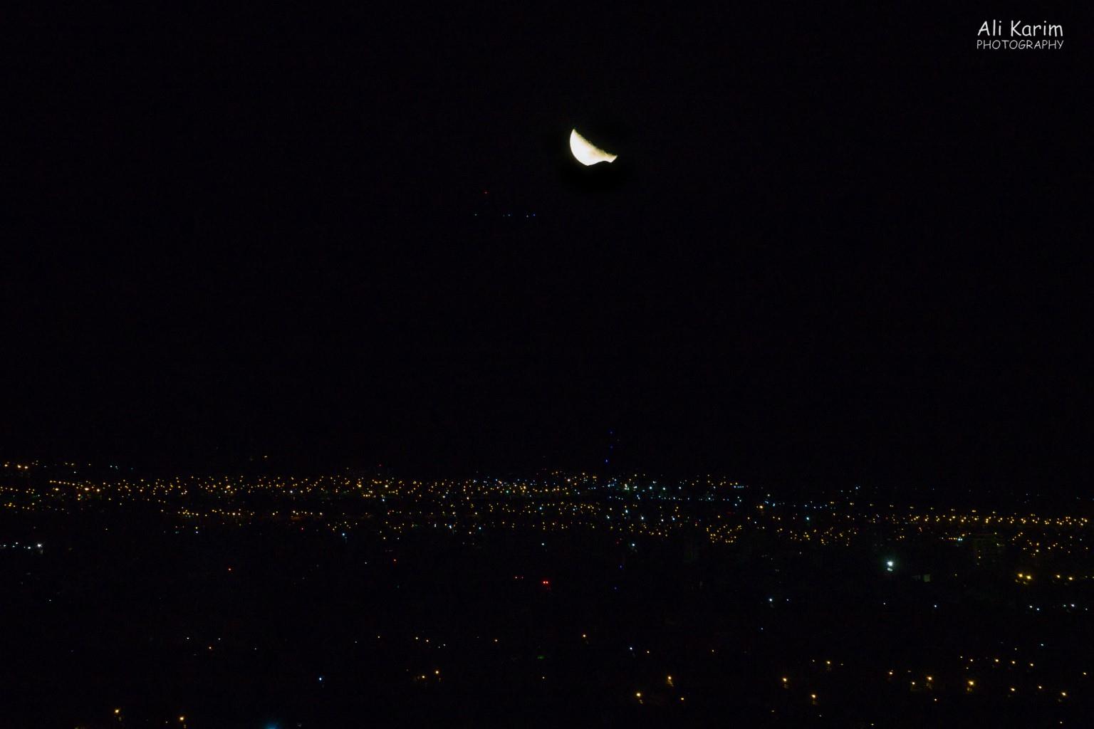 View of the moon; note the “bite” out of the moon is actually the moon setting over the Andes peaks Mendoza, Argentina View of the moon; note the “bite” out of the moon is actually the moon setting over the Andes peaks