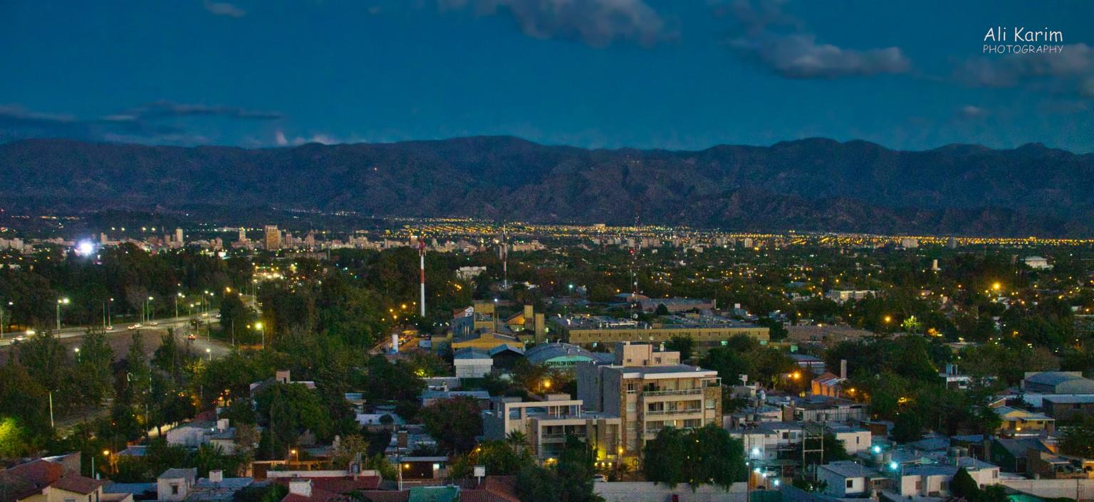 View of Mendoza and the distant Andes mountains at dusk Mendoza, Argentina View of Mendoza and the distant Andes mountains at dusk