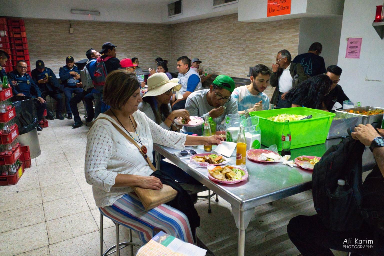 The tacos were worth waiting for; seating was at communal tables, with condiments in the center containers Mexico City, Mexico, Dec 2019, The tacos were worth waiting for; seating was at communal tables, with condiments in the center containers