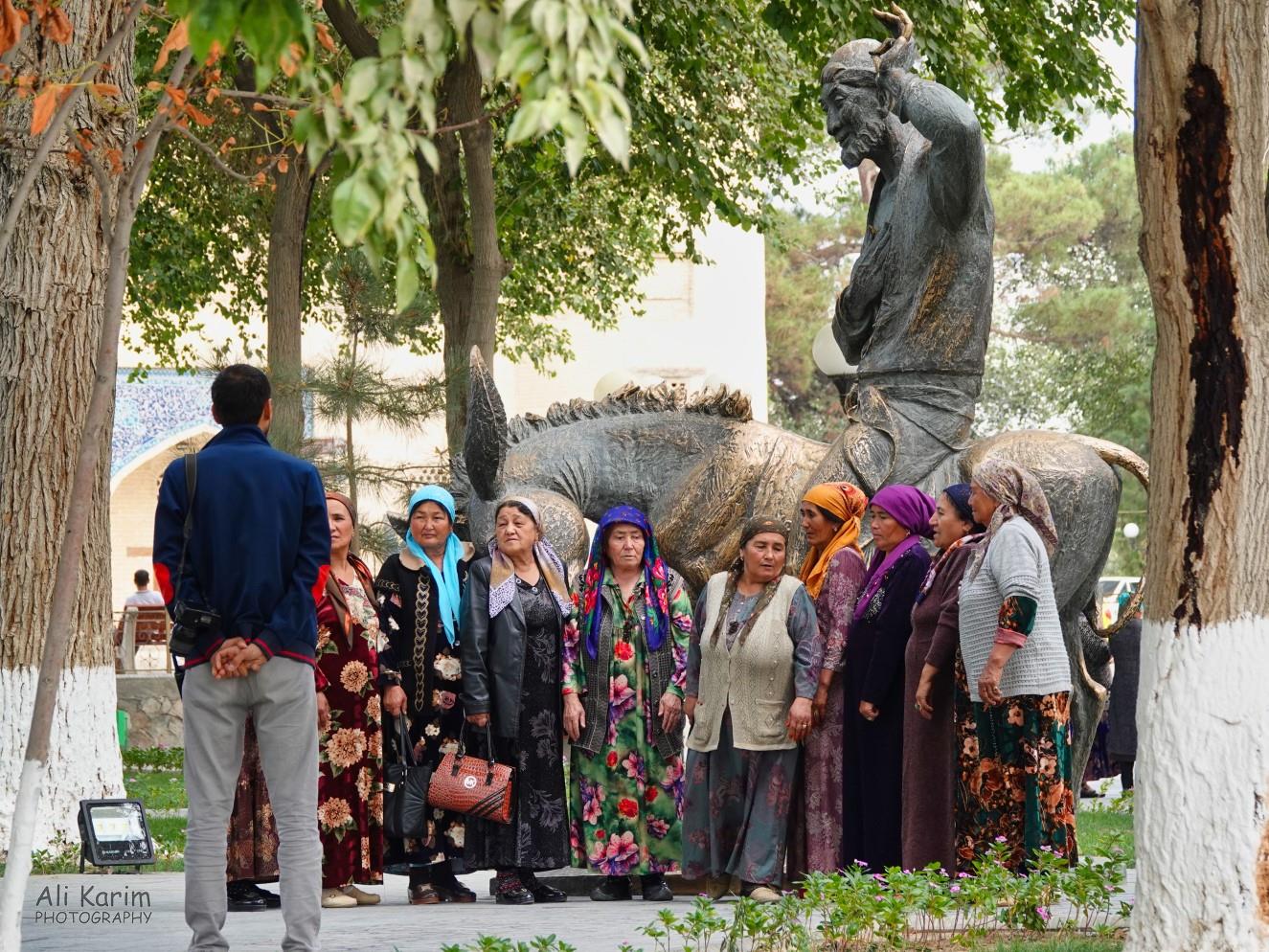 Local tourists with the statue of Mulla Nasruddin Hodja on his donkey Bukhara, Oct 2019, Local tourists with the statue of Mulla Nasruddin Hodja on his donkey