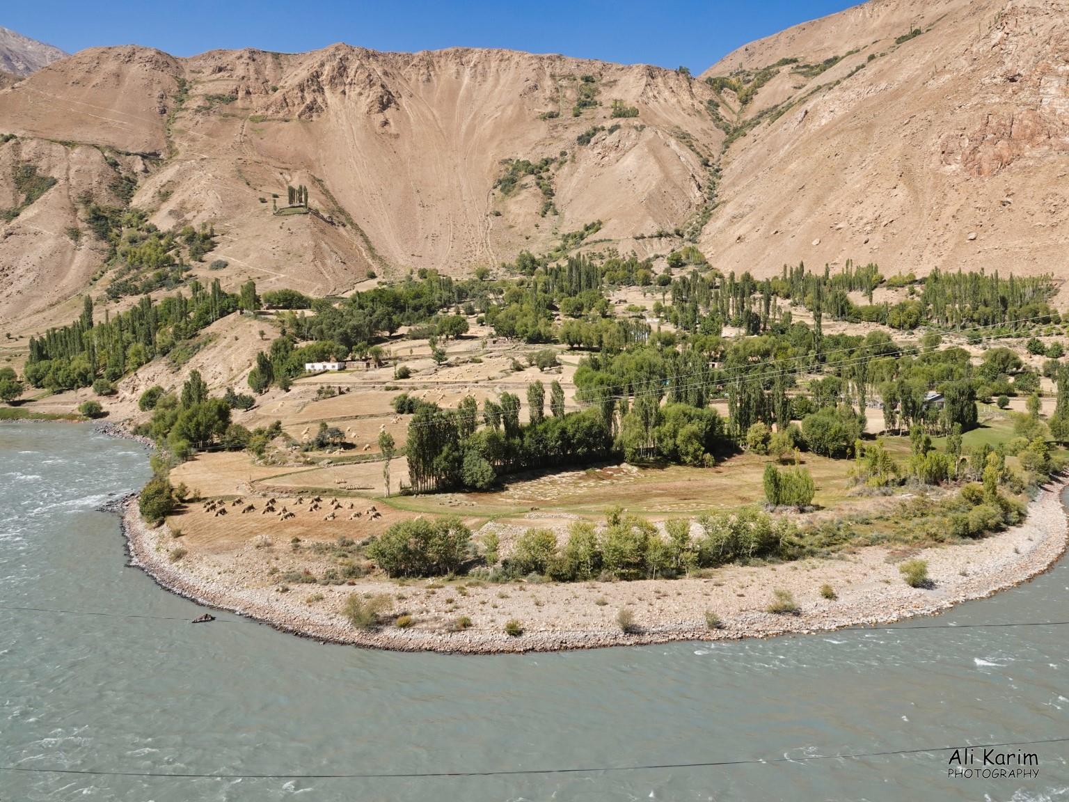 Nice farming settlement in Afghanistan along the Panj river Onto Khorog, Tajikistan, Nice farming settlement in Afghanistan along the Panj river