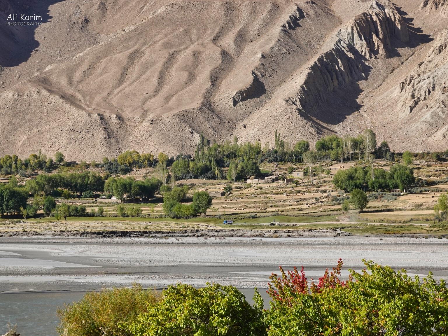Farming on flat lands along the Panj river on the Afghan side Onto Khorog, Tajikistan, Farming on flat lands along the Panj river on the Afghan side