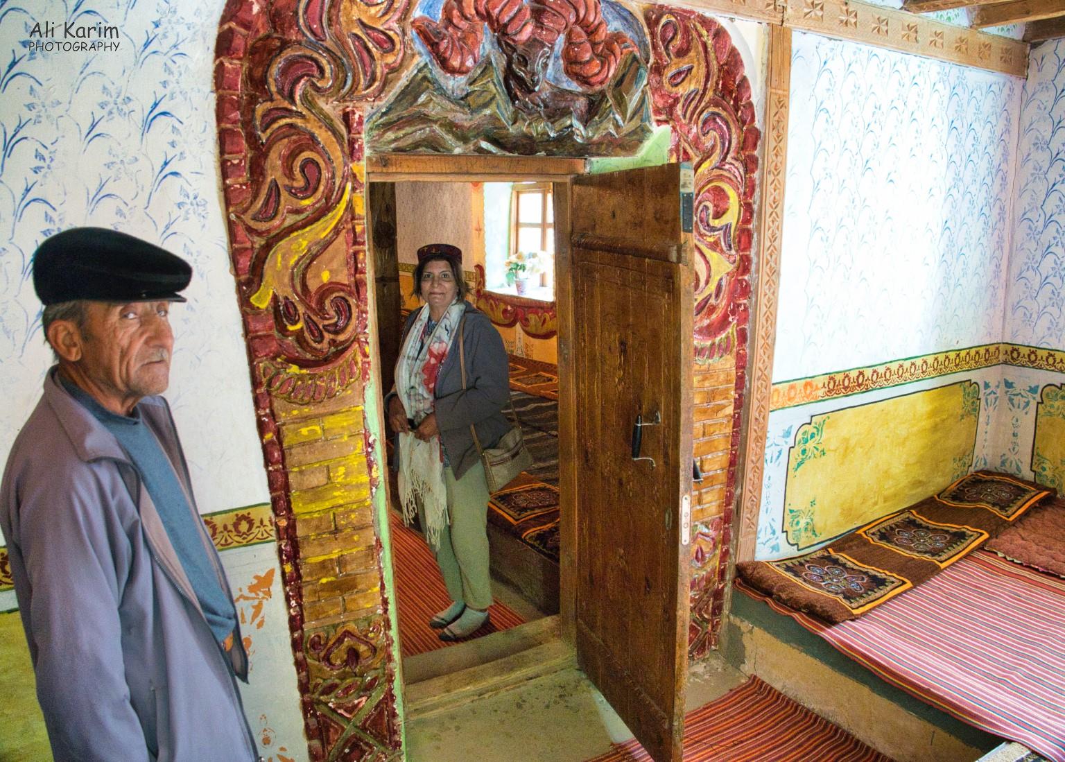 Entrance to Prayer Hall from Museum; note the elaborate woodwork and the Marco Polo sheep carving/painting. With the Museum caretaker Langar, Bulunkul Tajikistan, Entrance to Prayer Hall from Museum; note the elaborate woodwork and the Marco Polo sheep carving/painting. With the Museum caretaker